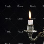 stock-photo-92477525-old-silver-candlestick-with-two-arms-on-a-black-background